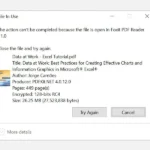 Cửa sổ thông báo lỗi "File In Use" trên Windows 10 khi cố gắng xóa tệp PDF đang mở.