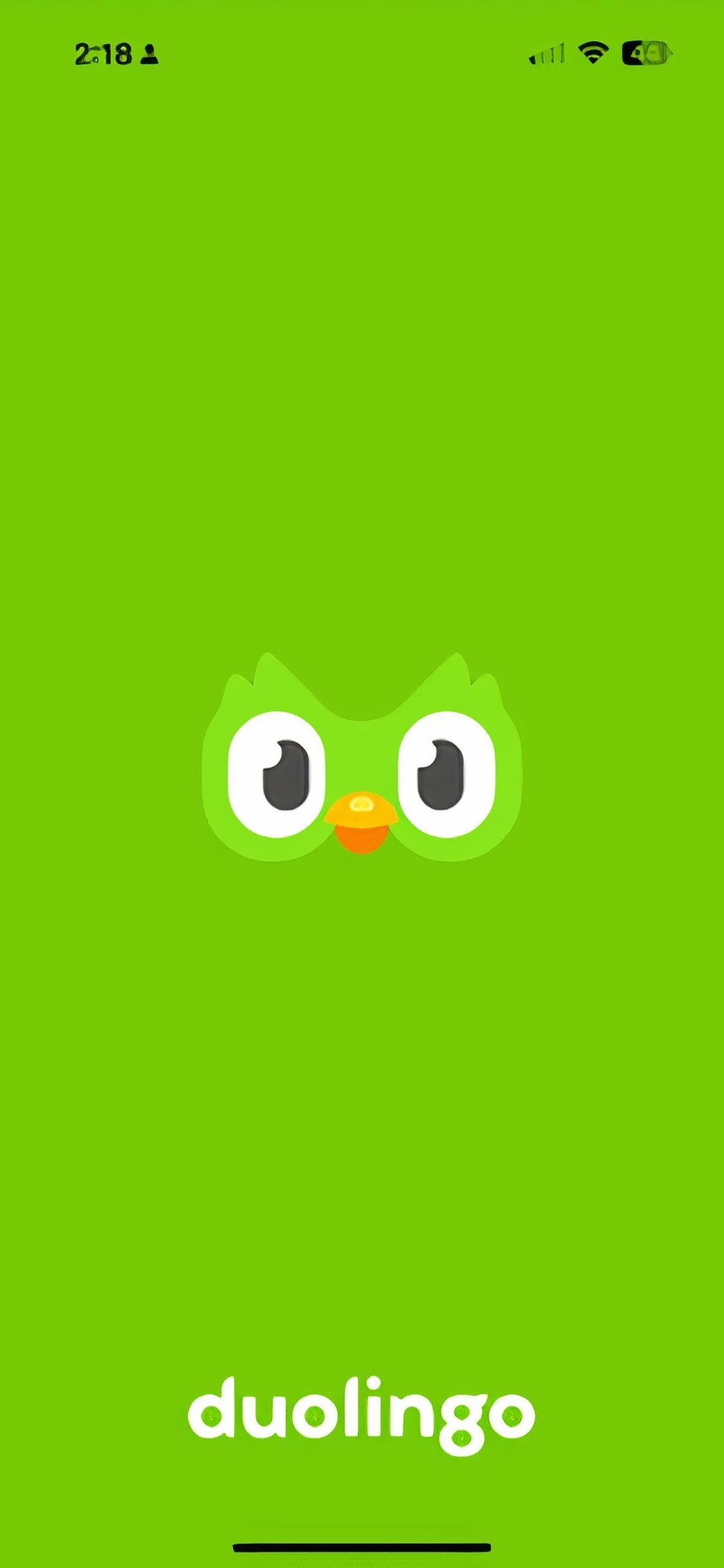 Màn hình chào mừng của ứng dụng Duolingo với hình ảnh linh vật xanh