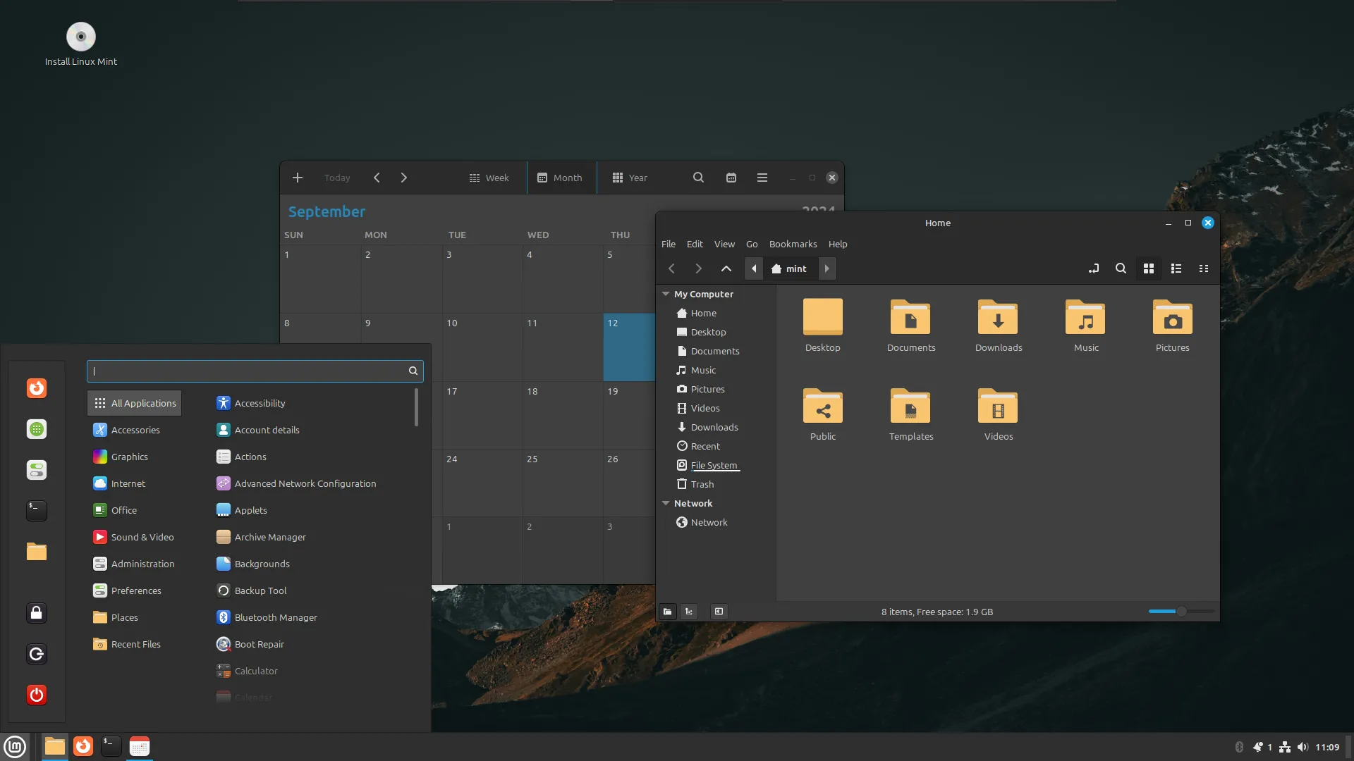 Màn hình desktop của Linux Mint với ứng dụng lịch và trình duyệt tệp đang mở, thể hiện môi trường làm việc quen thuộc
