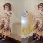 So sánh ảnh cũ của bé gái ôm búp bê trước và sau khi khôi phục bằng AI Picsart