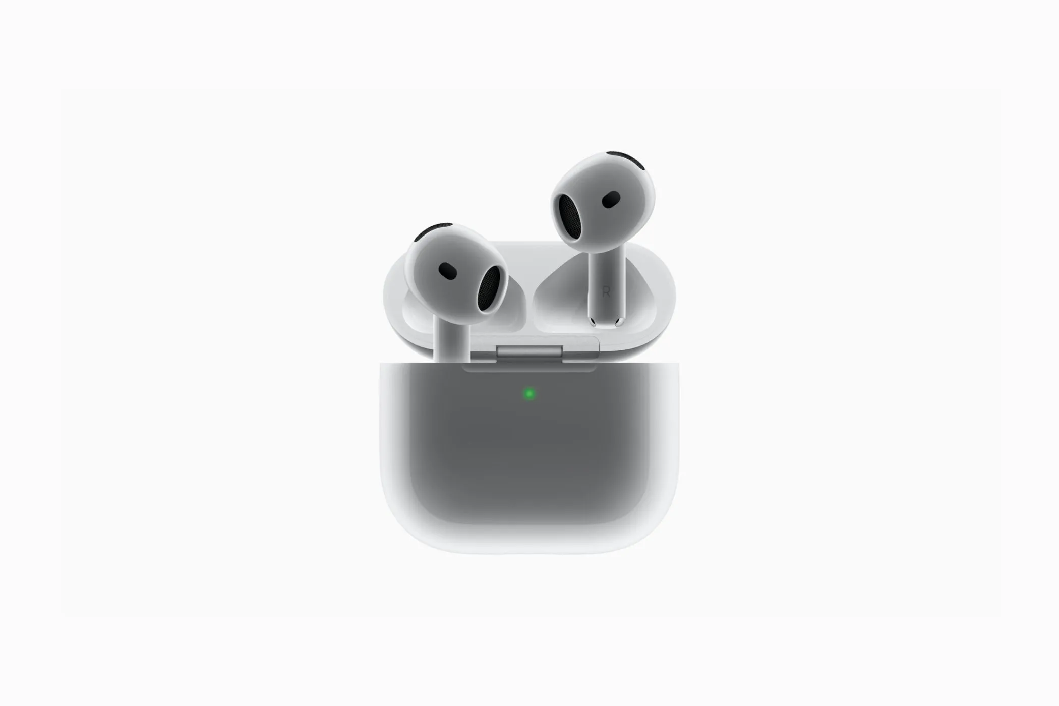 Tai nghe Apple AirPods 4 và vỏ sạc của nó, cho thấy thiết kế nhỏ gọn và không có nút ghép nối bên ngoài