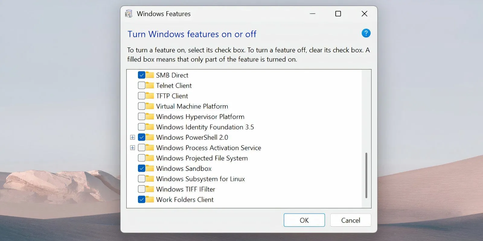 Trang Tính năng Windows hiển thị tùy chọn Windows Subsystem for Linux và Virtual Machine Platform đã bỏ chọn để tắt WSL